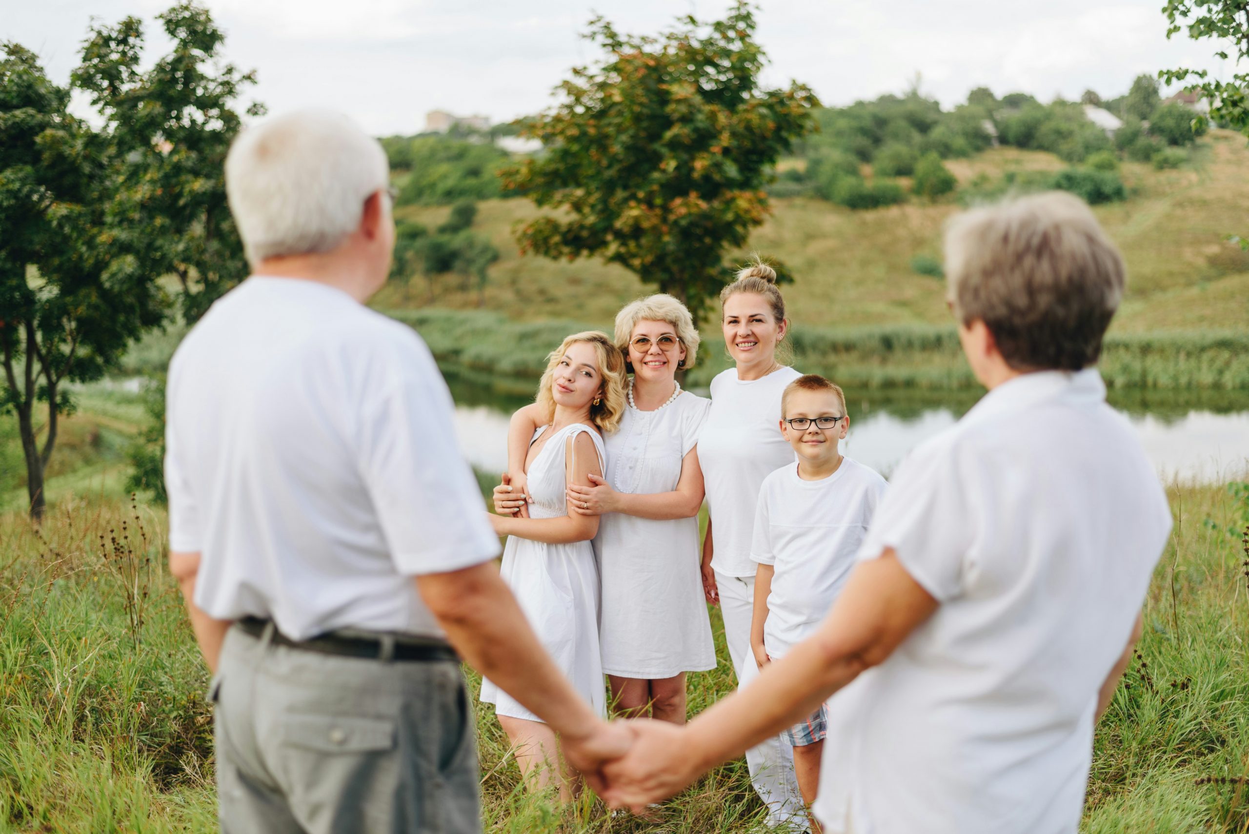 Three generations of family members gathering for a family reunion at an outdoor venue in mansfield, ohio